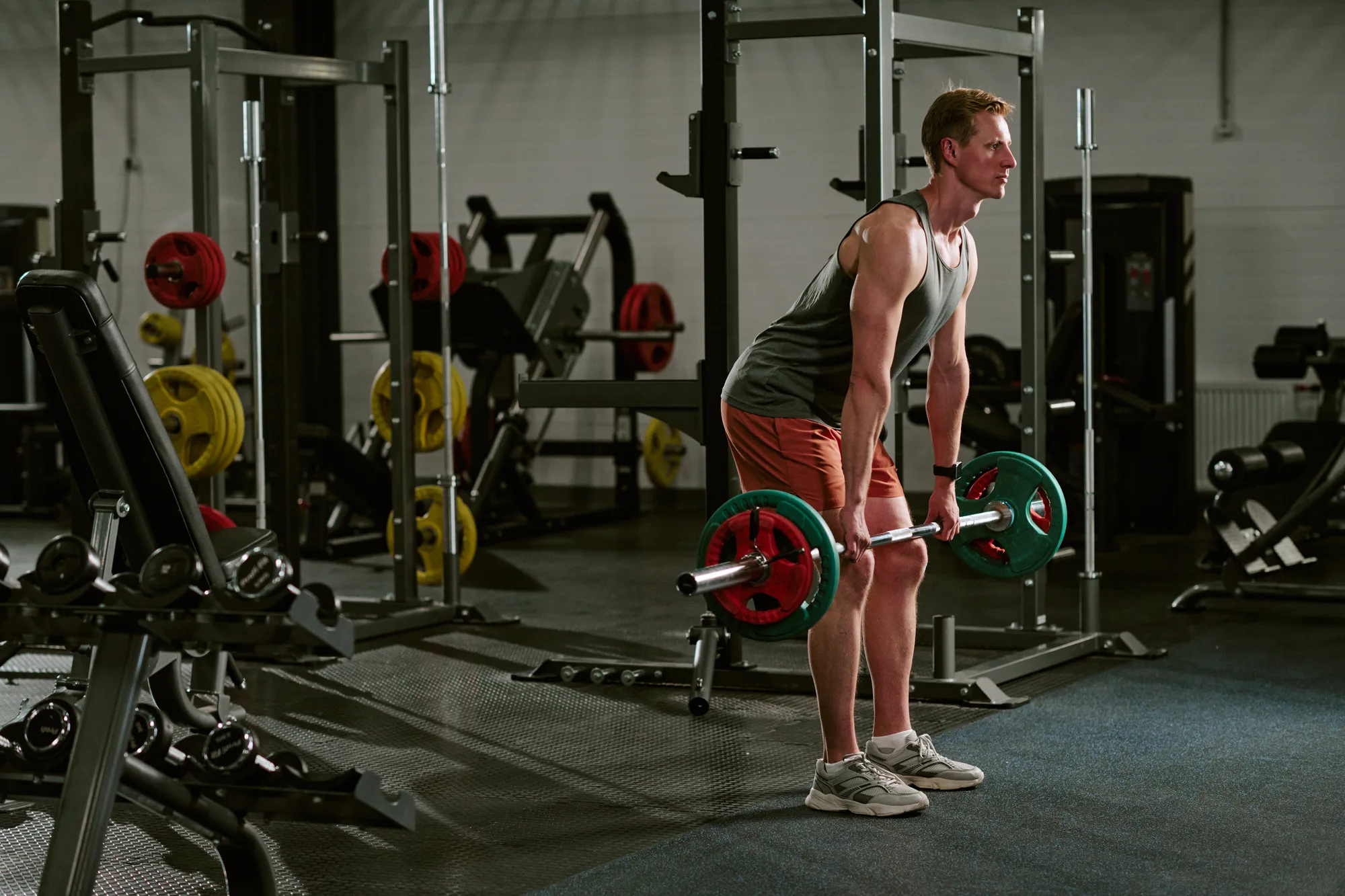 Man Performing Barbell Deadlift during Strength Workout