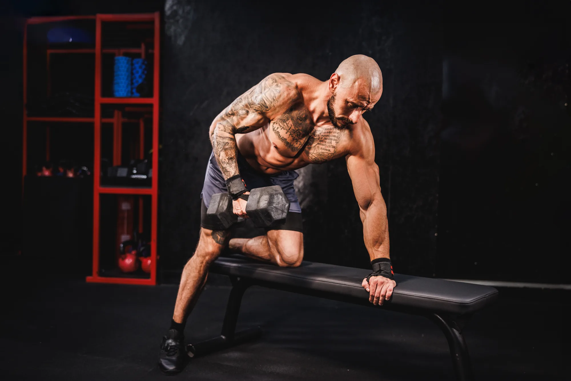 Man Doing Training With A Dumbbell For His Back Muscle At The Gym