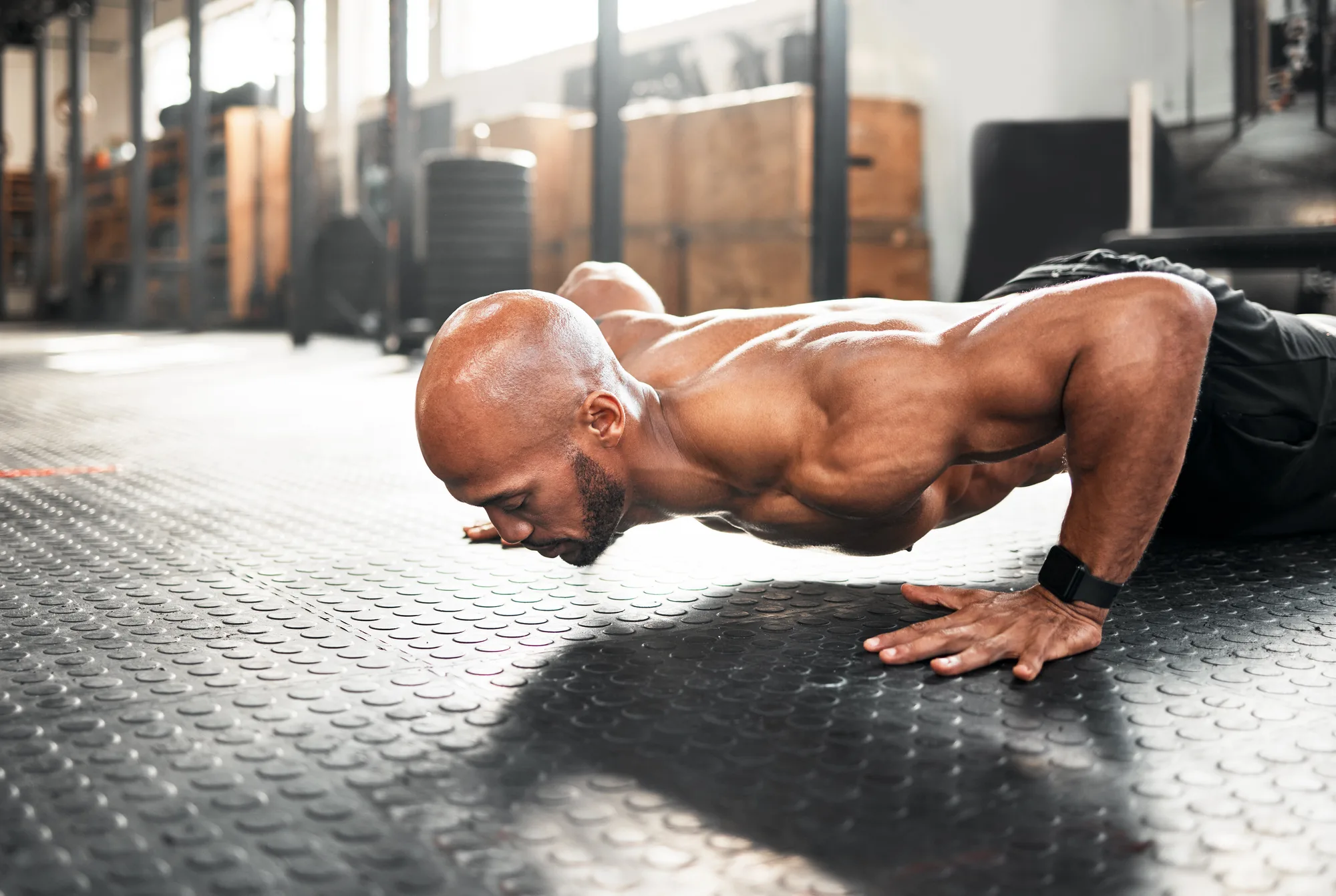 For those gains you need push ups. Shot of a young man doing push ups during a workout.